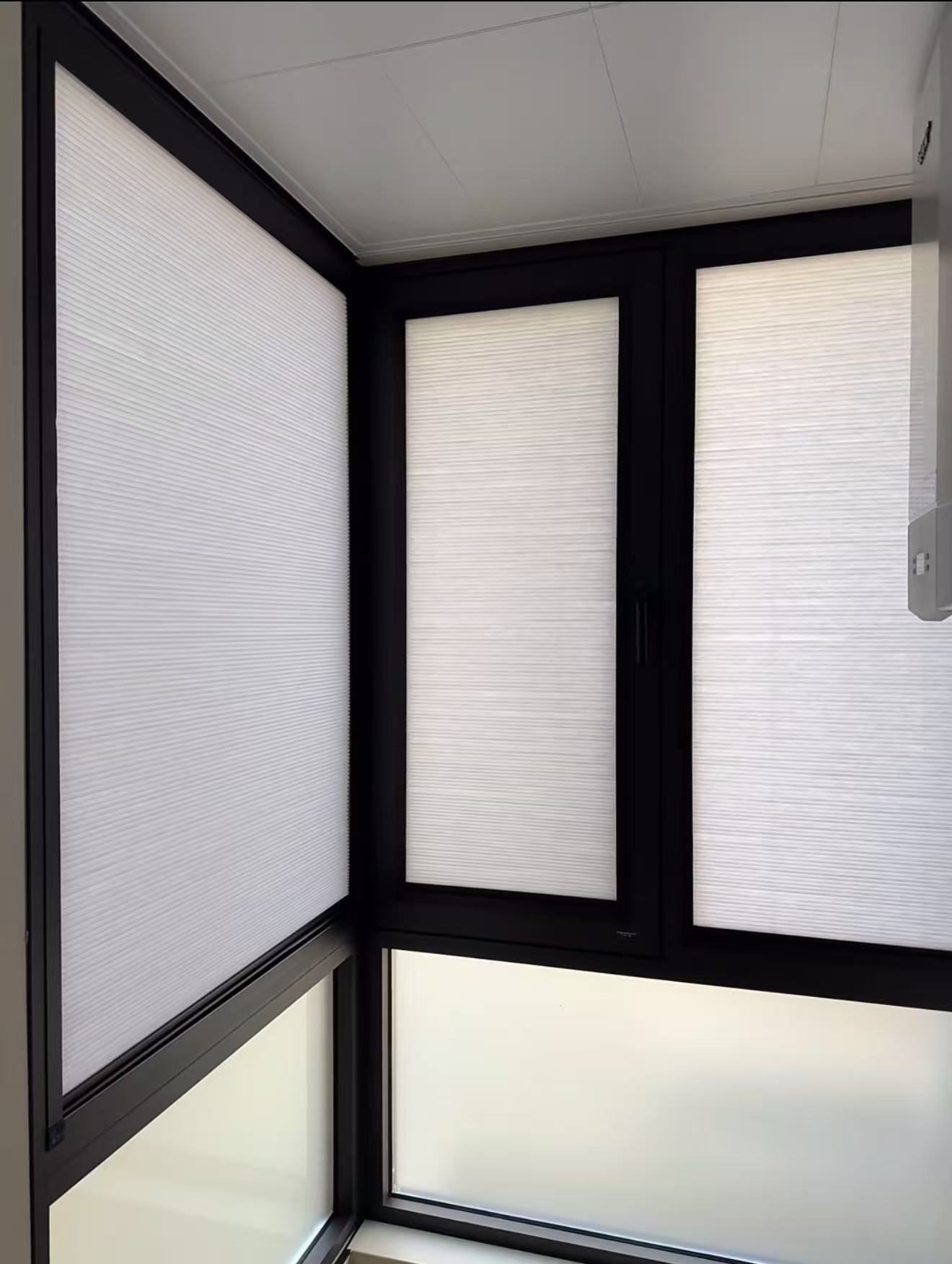 Honeycomb blinds fitted to corner windows
