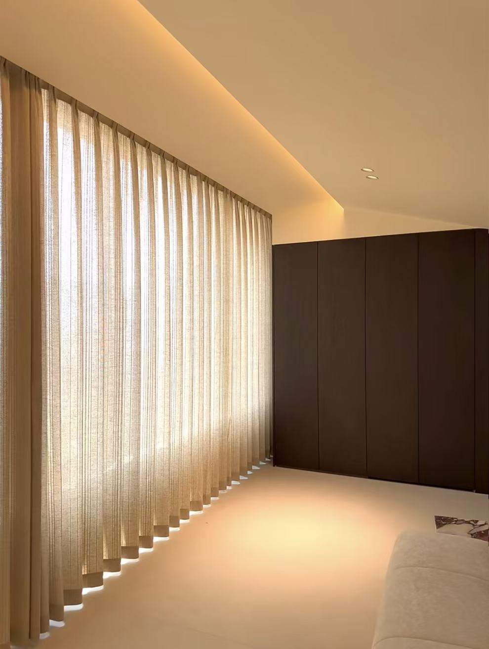 Pinch pleat linen curtains in a bedroom
