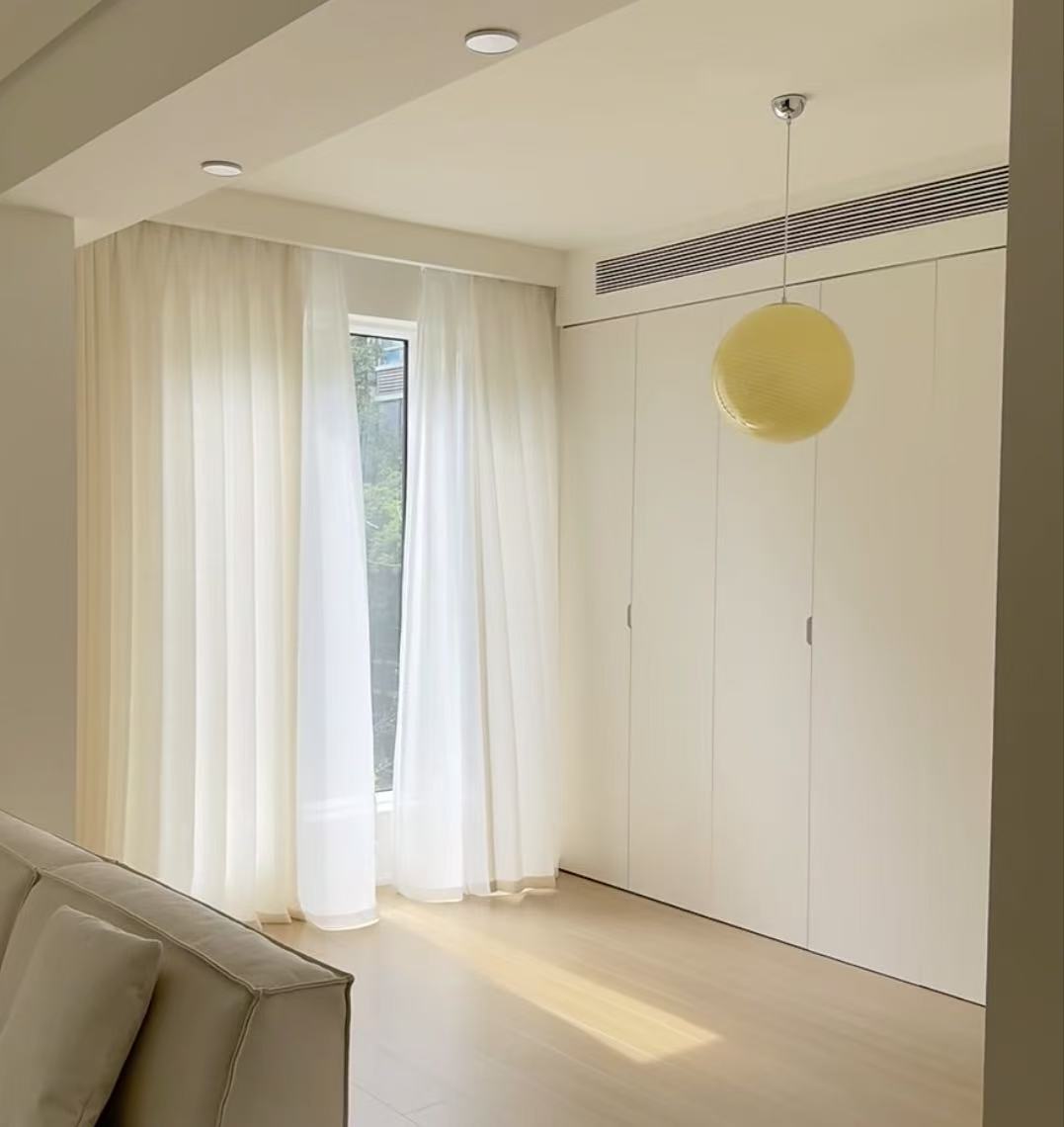 Soft sheer curtains in a bedroom