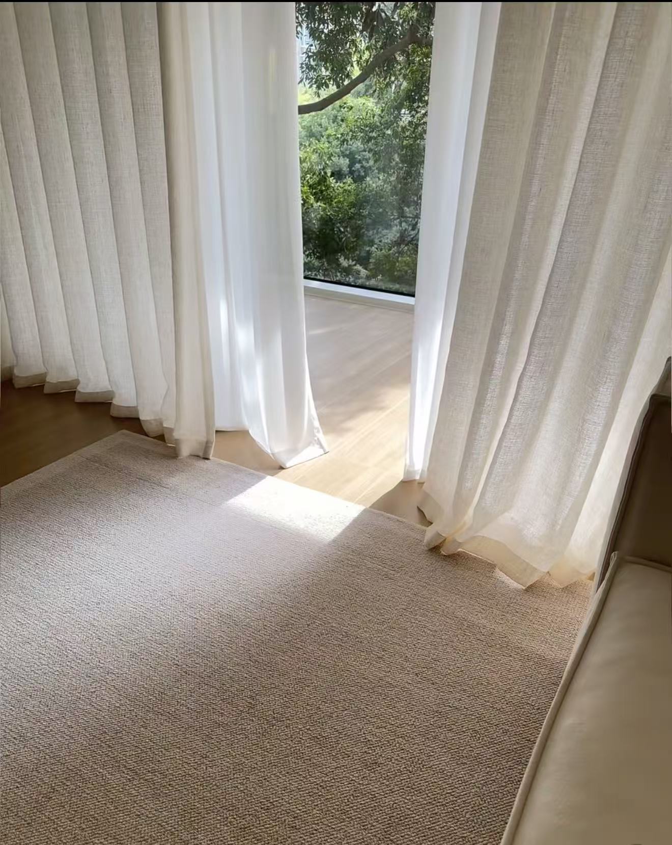 Sheer curtains at a corner window