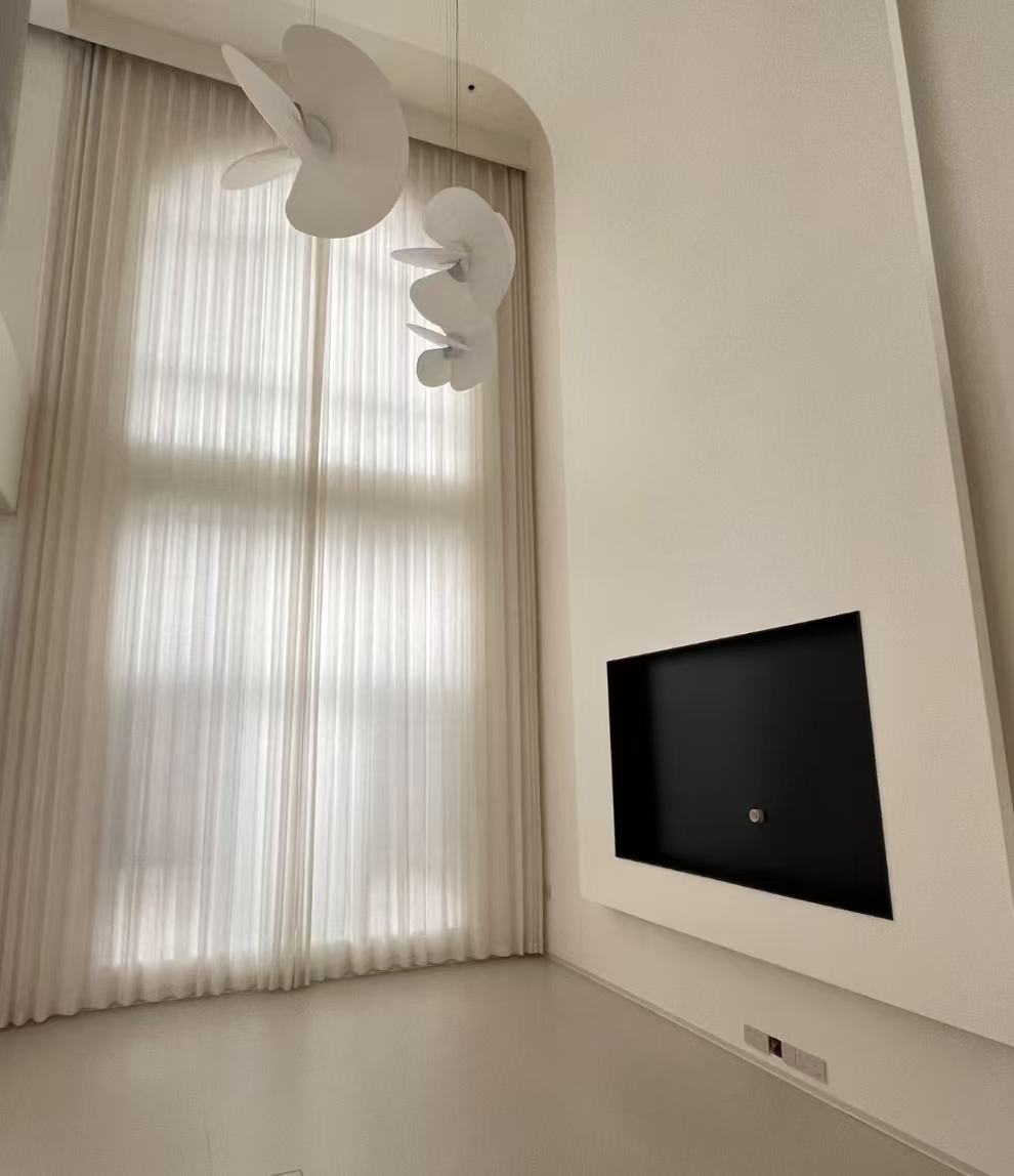 Pleated sheer curtains on a feature window