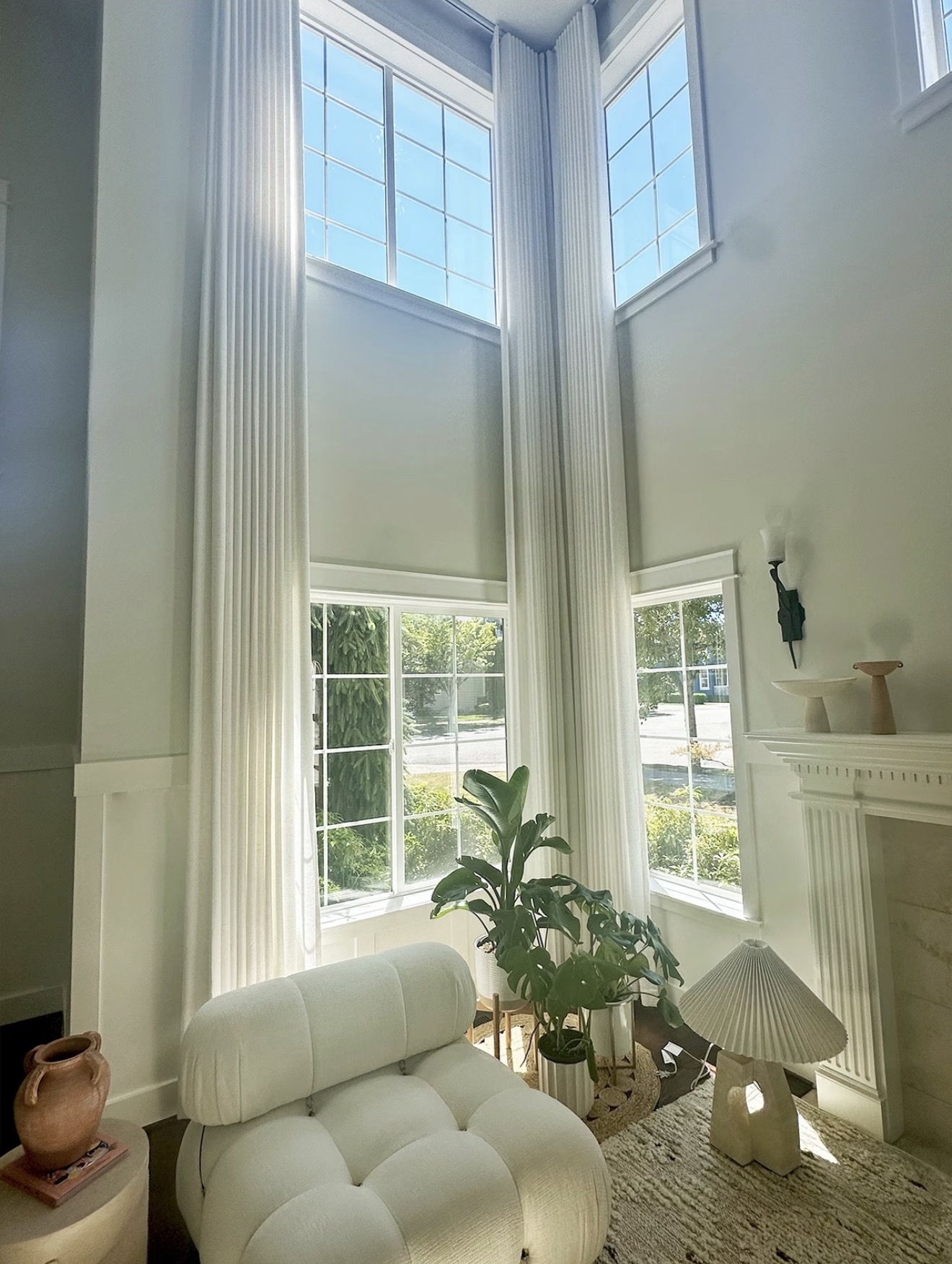 Custom sheer S-fold curtains in a light-filled living room