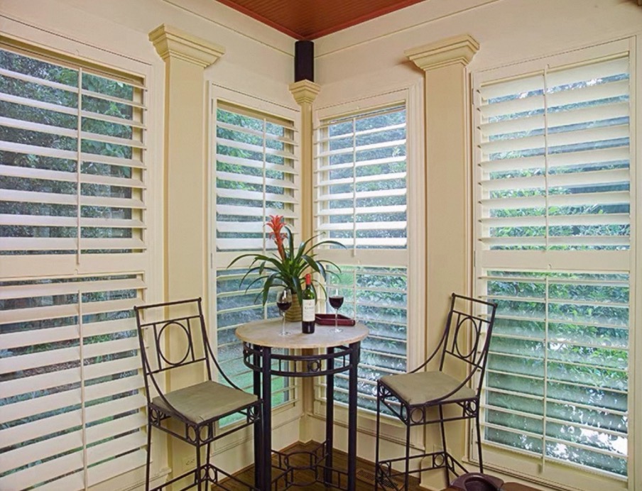 Plantation shutters in a garden sunroom