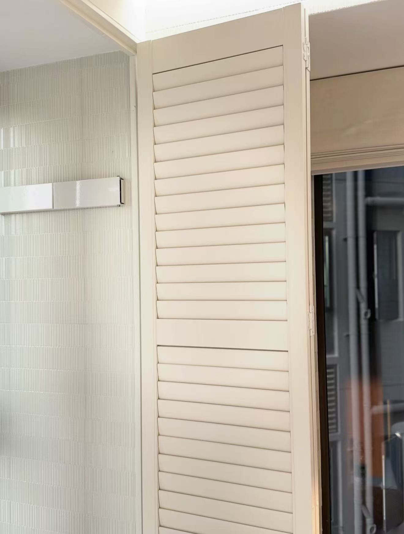Bi-fold shutters to a balcony door