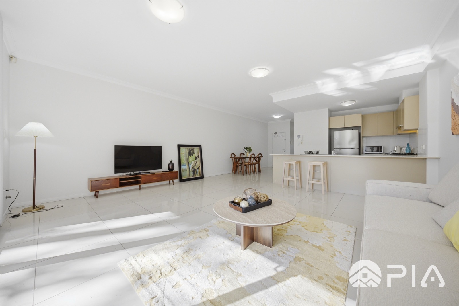 Airbnb living and dining styled with feature artwork