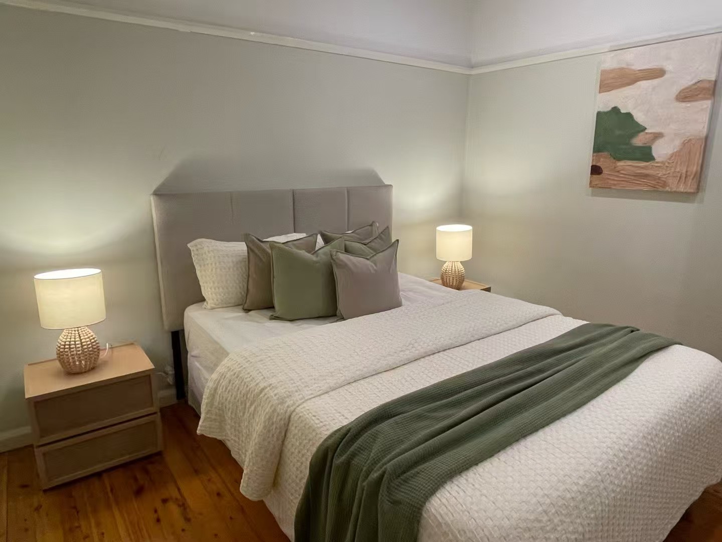 Bedroom styled with soft green tones