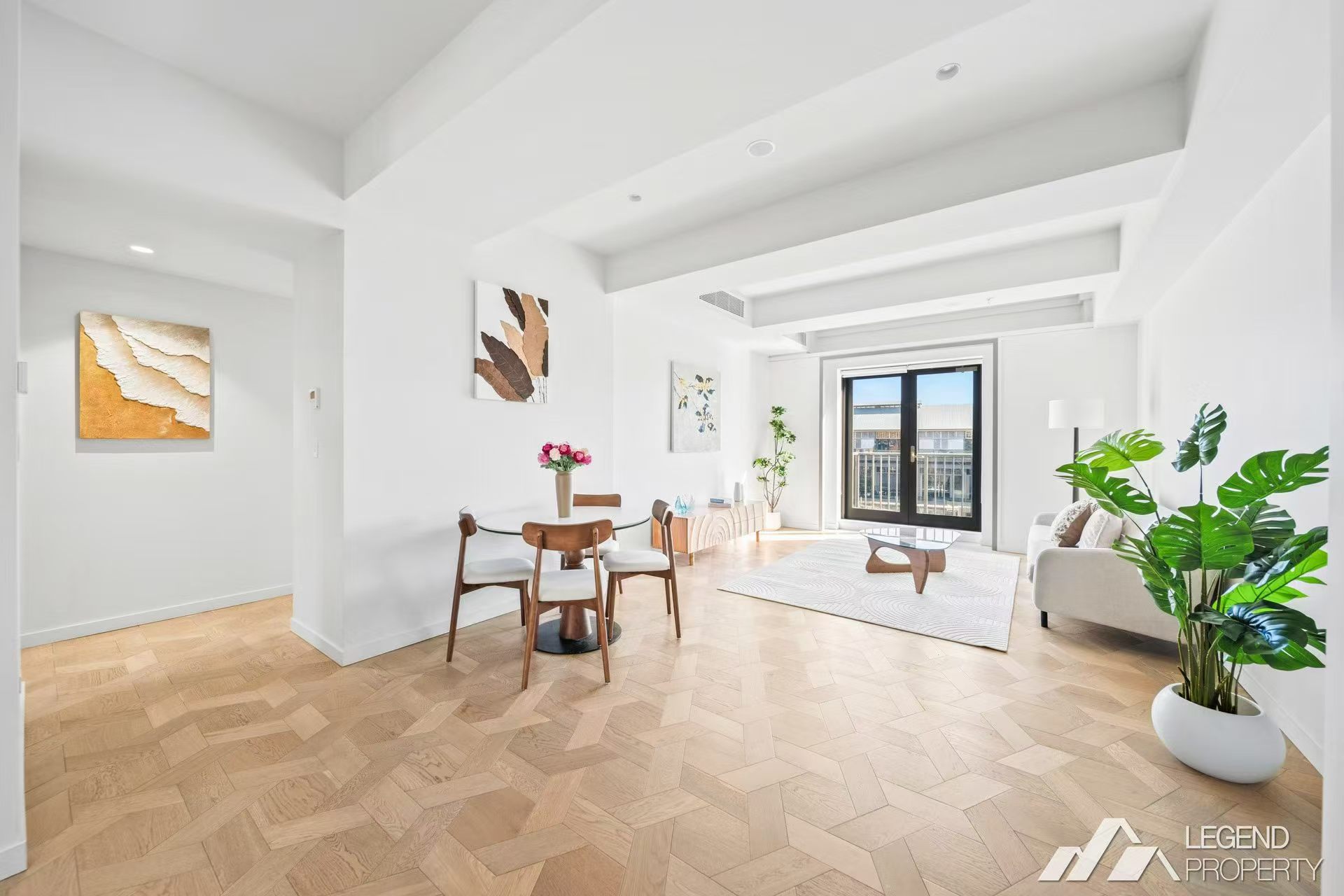 Open-plan living and dining with herringbone floors