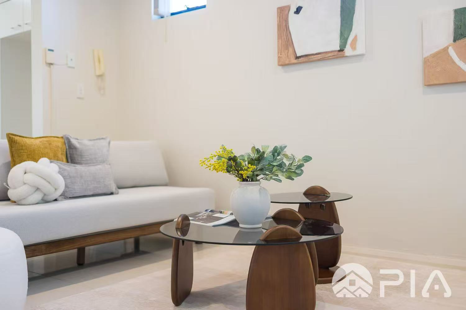 Coffee table styling with vase and greenery